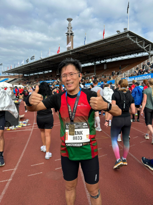 Henk Cheung met medaille